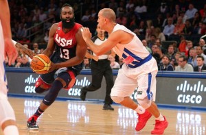 Carlos Arroyo of Puerto Rico defends James Harden of the USA in an exhibition match. Photo from Fansided.