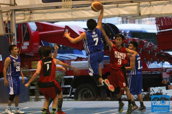 A Vipers player goes for a layup against several HumLet defenders. Photo by Raymond Trespeces