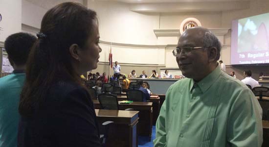 Councilor Ma. Belen S. Acosta (left) confers with the Ateneo de Davao University President, Jesuit priest Joel S. Tabora, before the city council session last Tuesday, [Feb. 16]. Photo and caption by Carmencita Carillo/Business World