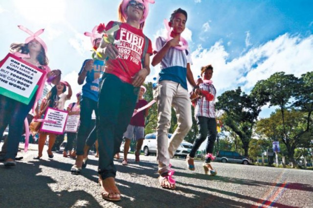 Boys in heels. Young boys share their support for women’s rights by wearing high-heeled shoes as they walk from Fuente Osmeña to the Cebu Provincial Capitol building in celebration of International Women’s Day. (Photo and caption by Sun.Star Cebu/Amper Campaña)
