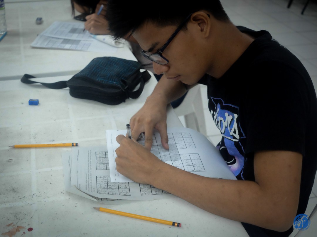A Sudoku player plans his number placement strategy. Photo by Hannah Lou Balladares
