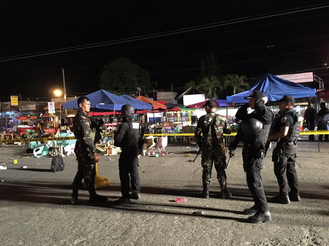 SWAT soldiers after yesterday's explosion along Roxas Avenue near the university Community Center. Photo from Fr. Jboy Gonzales SJ's Twitter account